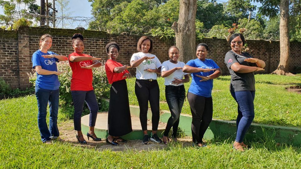 GOAL Malawi's Head of Programmes Janet Mwangomba (right) strikes the #EachForEqual pose with her colleagues in Blantyre, Malawi in support of International Women's Day 2020.
