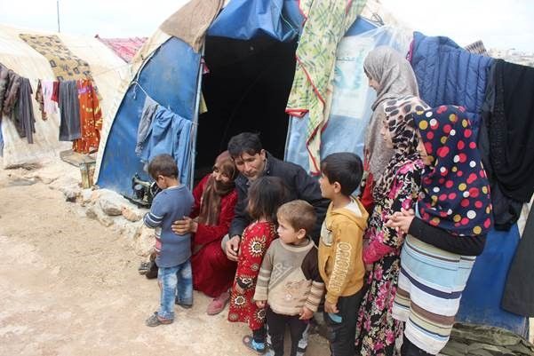 Omar and Rima with their children in IDP camp in Northwestern Syria.