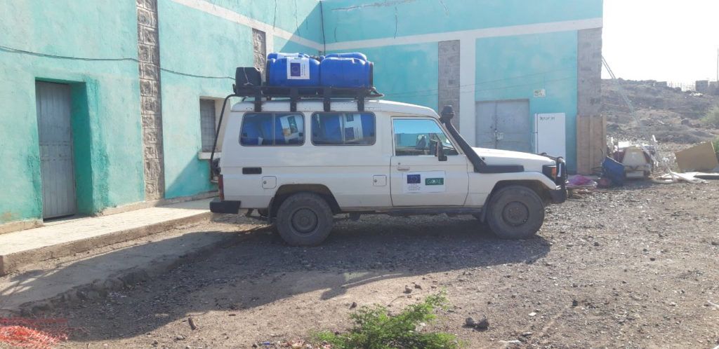 COVID-19 Ethiopia. GOAL vehicle delivering water barrels to Aysaita hospital/refugee camp in Ethiopia with ECHO funding
