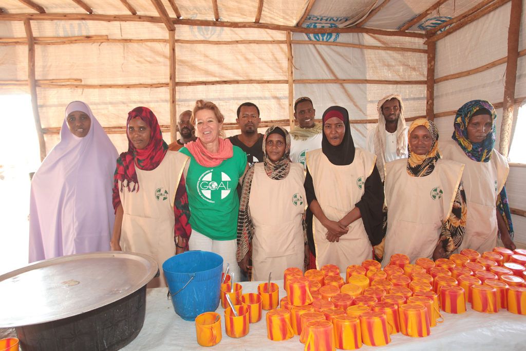 Mary T Murphy on a visit to the GOAL's Nutrition Site at Buramino Refugee Camp, Dollo Ado, on the Somali Ethiopian Border, where GOAL are treating moderately and severely malnurished refugees after arriving from Somali. Since 2011 over 100,000 Somali Refugees have fled the border into Dolla Ado Refugee Camps. At the GOAL Pre-Registration Site, at the Somalian Border where Somalian Refugees are given the nutritional wet blanket programme, porridge, a blend of corn and soya milk products, GOAL's Mary T Lynch Field Project Manager is with GOAL Cooks who are preparing the food for the incoming refugees.Photo:Valerie O'Sullivan/GOAL