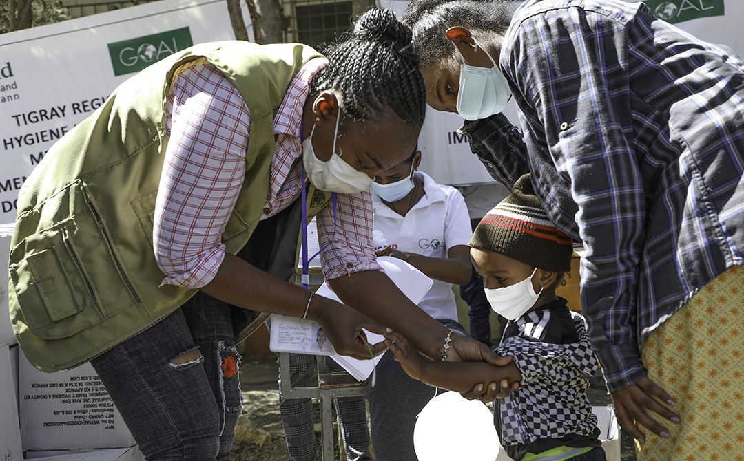Ethiopia-Tigray-Alemash-Berhe GOALie Alemash assesses children arriving at a GOAL camp for malnutrition