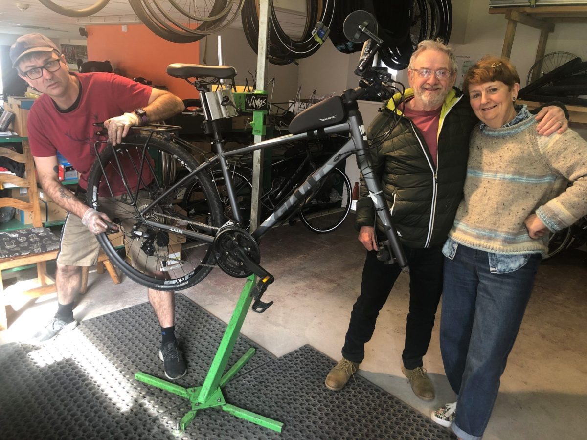 Eddie and Annie getting their bikes serviced before setting off