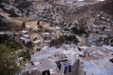 Hillside Homes in Haiti Sprawling settlements of poor housing on the outskirts of Port-au-Prince, Haiti. Population pressure has forced people to build further and further up the hill away from the coastline. This is very dangerous, as rainstorms can cause flooding and the collapse of such areas.