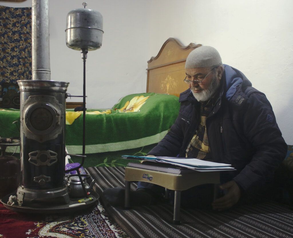 Suleiman is preparing a lesson for his students at his room.