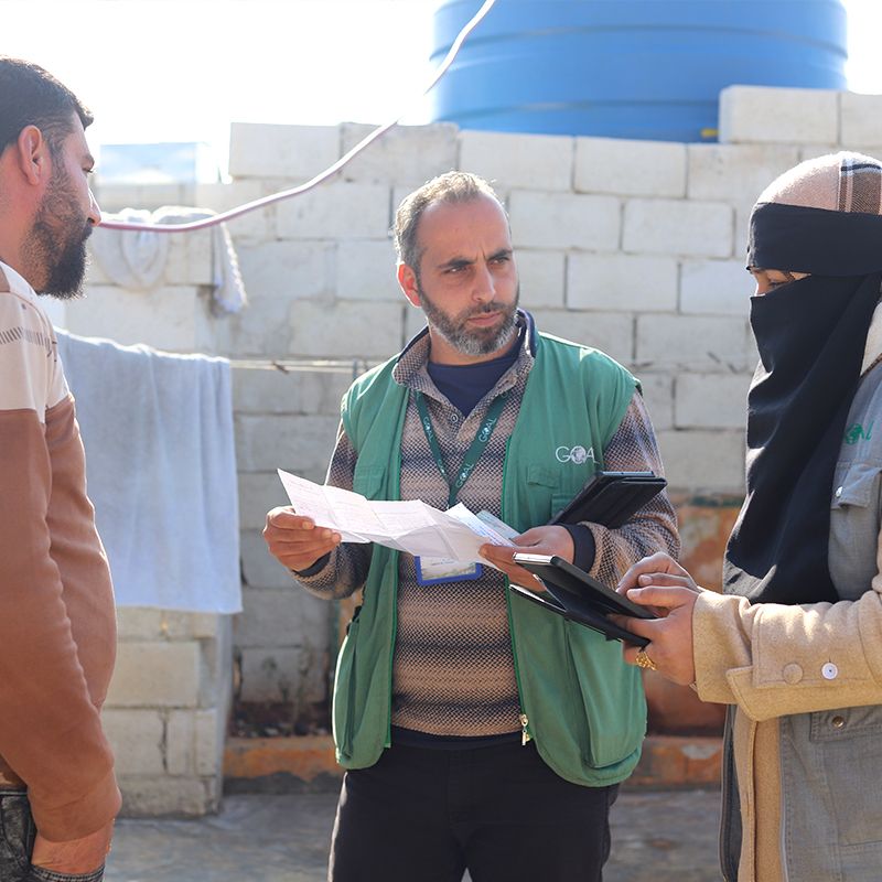 SANAD Cycle 2_SY_GOALies with beneficiary_body_square GOAL staff in Syria speaking to returnees following the end of the conflict.