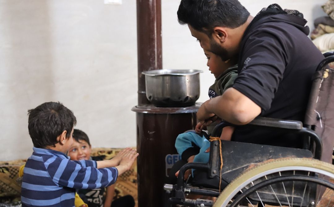 SANAD Cycle 3_LP_winterisation beneficiaries Abu Hilweh and his children at their home.