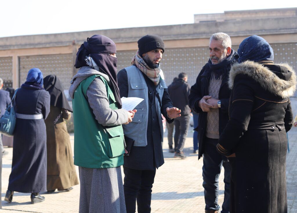 GOALies at a cash distribution point in Idlib, supporting families returning to eastern Idlib after the conflict ended in December 2024, as part of the emergency response.  © GOAL Syria. Photographs by Ahmad Al Ibrahim.