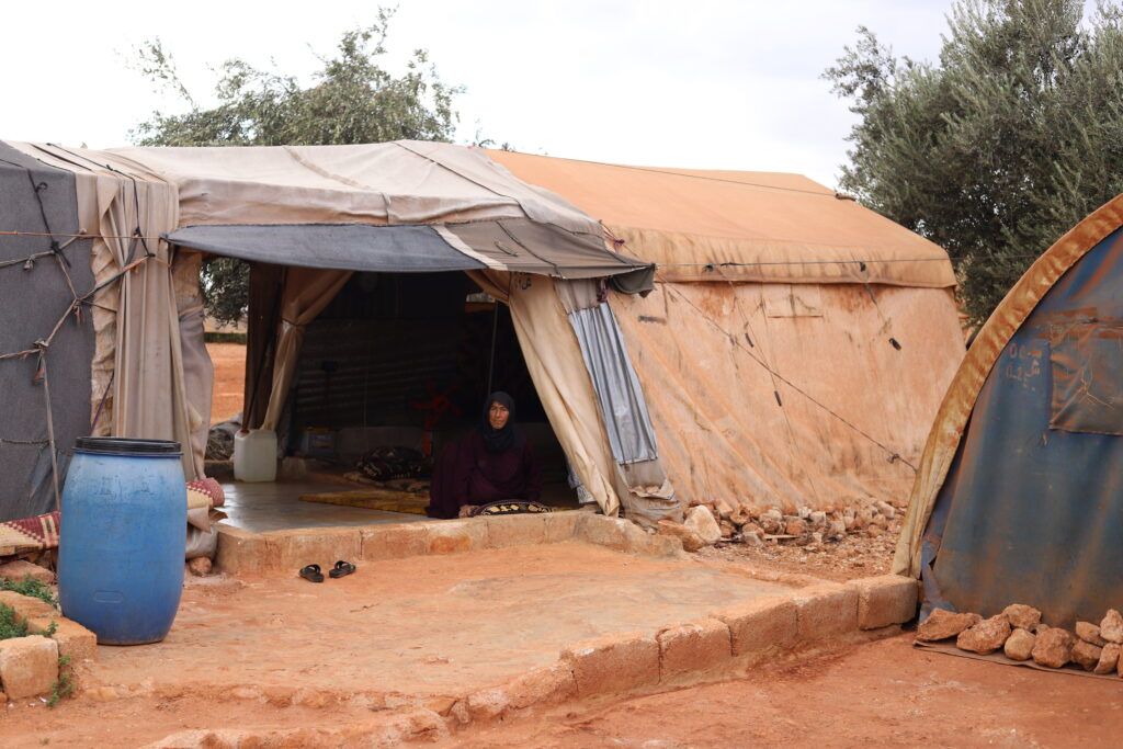 Hajjeh Al-Jassem -70 years old- in her tent, Ma’arat al-Nu’man, Idlib, before moving to the dignified Shelters. © GOAL Syria. Photographs by Ahmad Al Ibrahim.