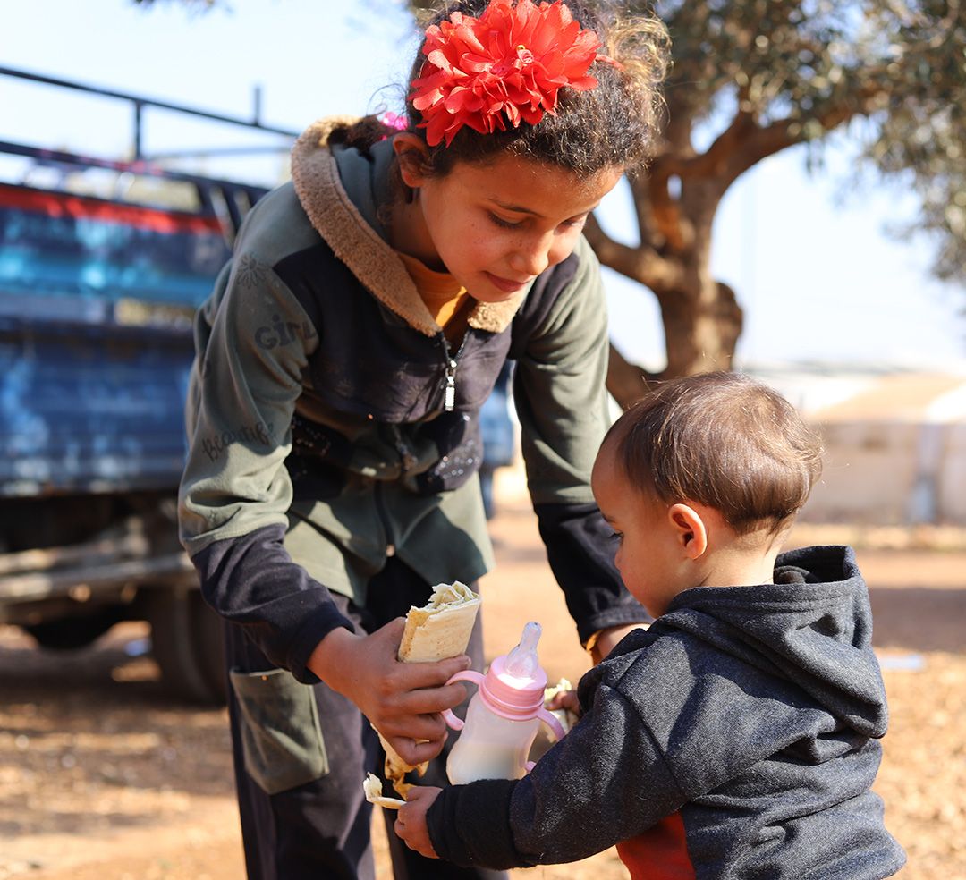 Sanad-Tariq-Syria-family-daughter-son-small 10-year-old Ahlam caring for 1-year-old Farah