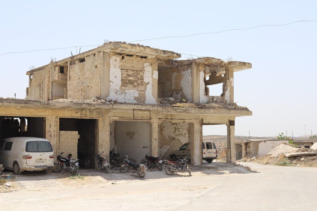 A destroyed building in Haysh village -controlled by the previous regime- southern Idlib. Showing the marks of shelling from years of war in the area e.