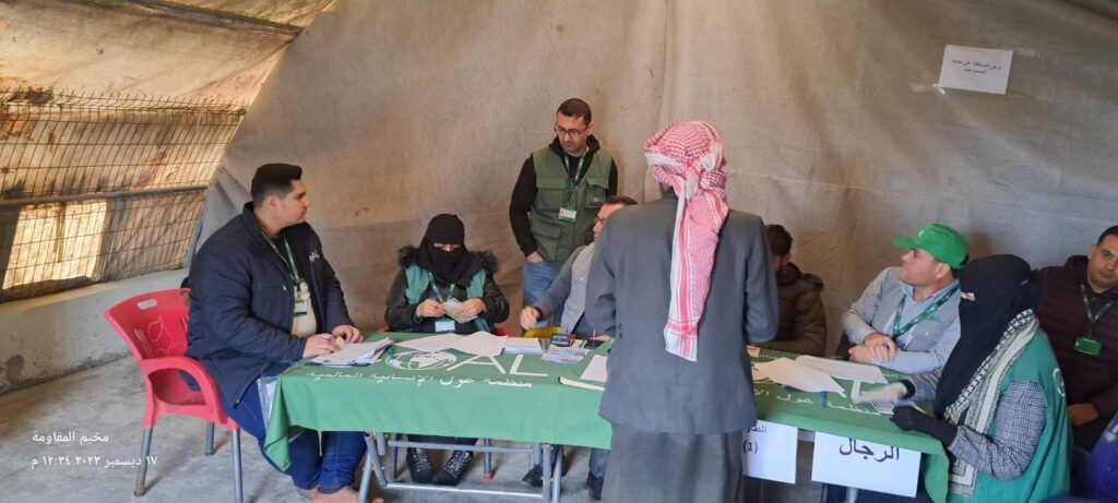 Mosab Hajismael and MPCA team at GOAL Syria distribution point in Mukavema Camp- Azaz, Aleppo