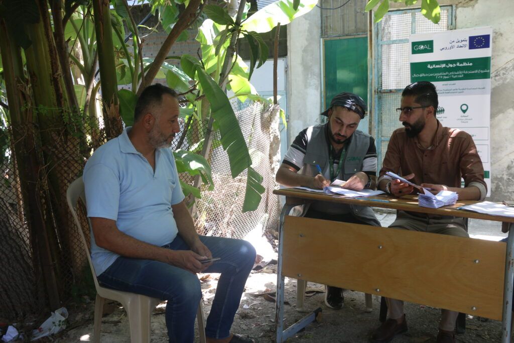 GOAL’s MPCA Team at the distribution point in Rabee'a, Latakia, engaging directly with beneficiaries to provide cash following the wildfire.