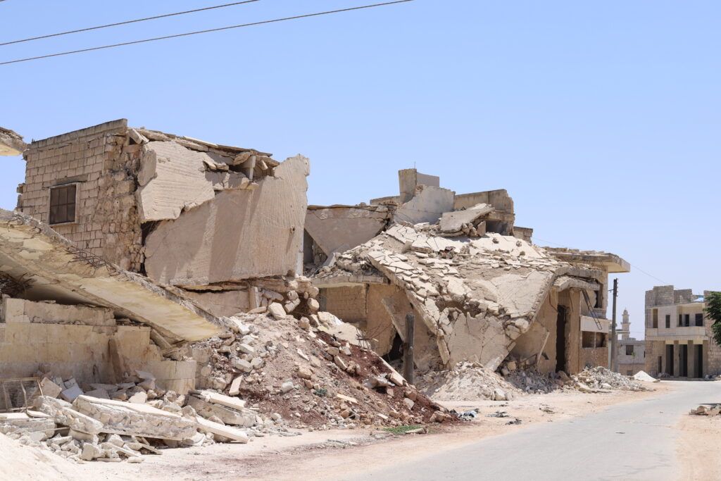 A building destroyed in Urem Al-Kubra, Western Aleppo countryside, highlighting the impact of the conflict on local infrastructure and the urgent need for rehabilitation projects.