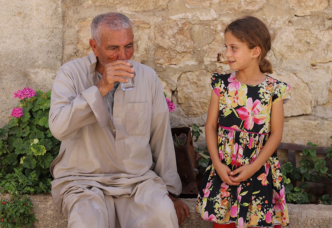 Mohammad with his  10-year-old granddaughter Noor
